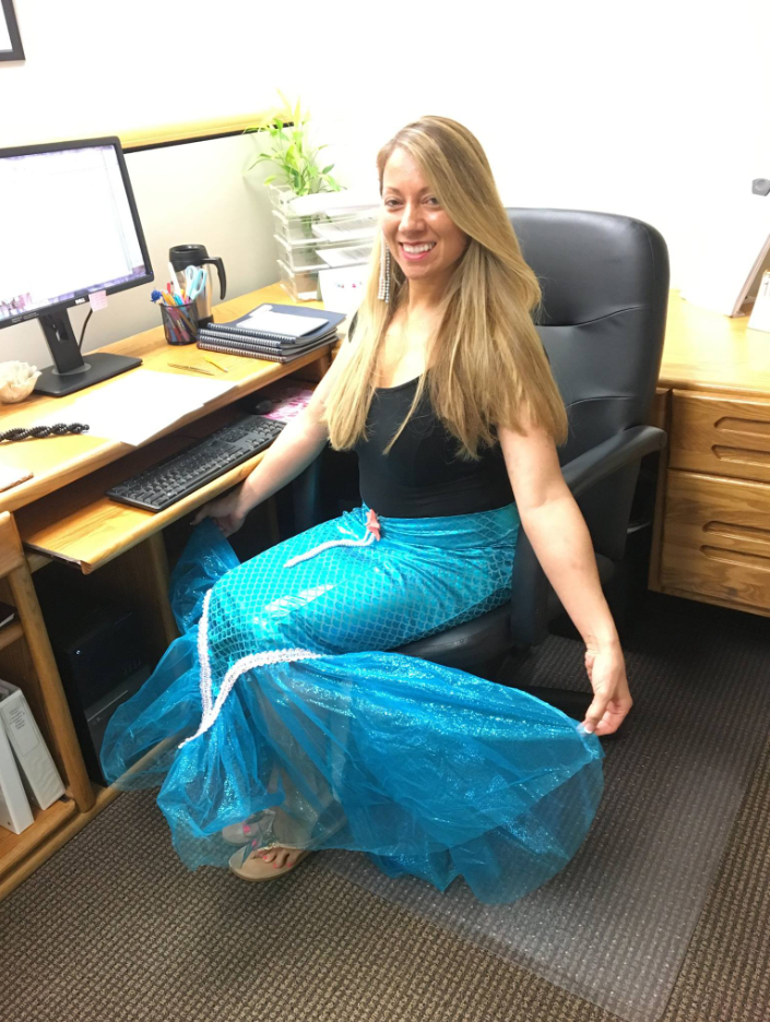 Team member in mermaid costume